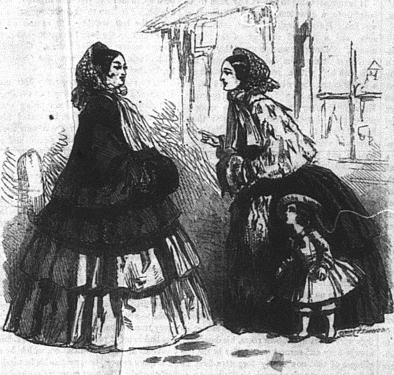Two adult women talking to each other, with a young girl standing next to one of them.